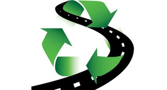 Icon of recycle symbol over road